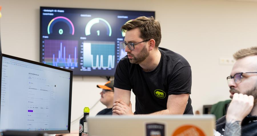 Hosting specialists watching their monitor.